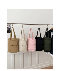 Detailed row of quilted tote bags in five colors hanging for daily commute and laptop storage