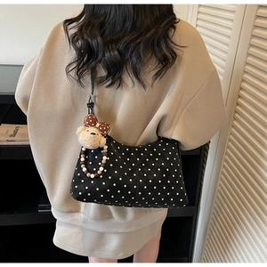Polka dot shoulder bag with cute plush bear charm and colorful pearl bead chain details
