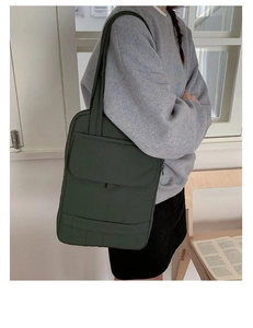 Quilted olive green tote bag for women showing spacious compartments and nylon texture