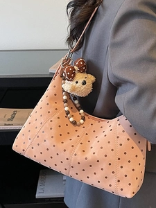 Pink polka dot shoulder bag with cute teddy bear charm and beaded detail for women