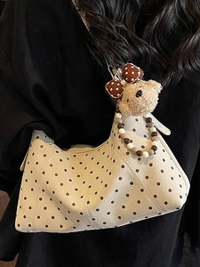 Polka dot faux leather shoulder bag in beige with cute bear charm and beaded strap
