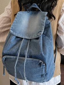 Vintage blue washed denim backpack with drawstring closure and large capacity for women