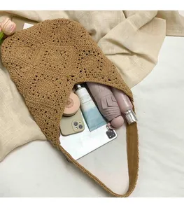 Brown woven tote bag showing large capacity for tablet, umbrella and phone storage