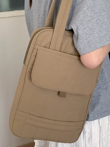 Minimalist tan canvas tote bag for women with multi-compartments for work and commuting