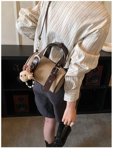 Retro khaki PU leather bowling bag with brown straps and a cute plush bear charm