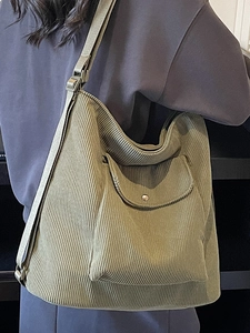 Olive green large corduroy hobo bag with adjustable wide strap and metal buckle