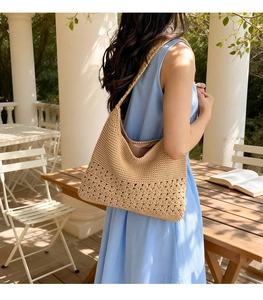 Detail of beige crochet tote bag with intricate floral knit texture and inner lining