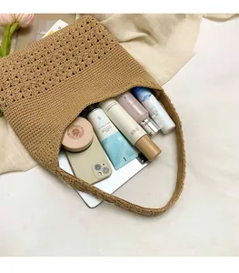 Detailed view of the large capacity interior of this woven tan beach tote bag