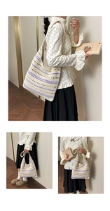 Detail of hand-woven hollow knit tote bag with purple stripes and wide shoulder straps