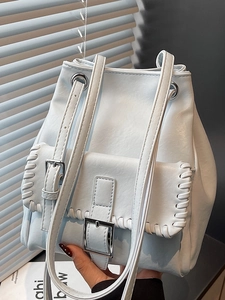 Fashionable light blue PU leather bucket shoulder bag with woven edges and silver buckle