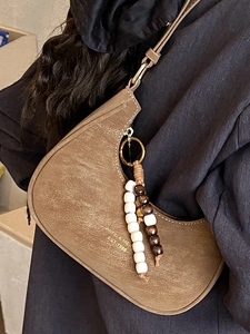 Retro brown dumpling shoulder bag with beaded tassel and vintage texture for women