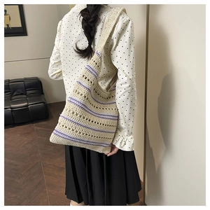 Detail of hollow woven tote bag with purple stripes and high-quality knit texture