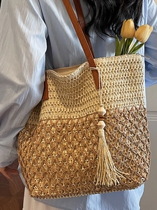 Chic color-block woven tote bag with leather straps and fringe for spring casual style