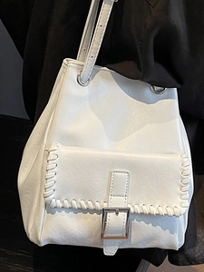 Minimalist white PU leather shoulder bag with decorative whipstitch and silver metal buckle