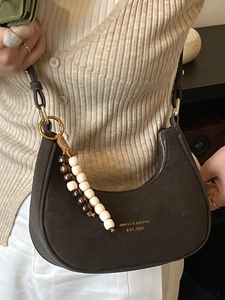 Vintage dark brown suede hobo bag with wooden bead charm and golden brand lettering