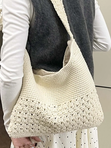 Artistic cream crochet tote bag with hollow flower patterns and shoulder strap style
