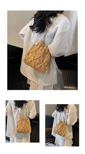 Detail of bohemian woven bucket bag with intricate geometric hollow patterns and drawstring