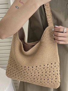 Woven straw tote bag with cutout pattern and brown fabric lining for summer vacation