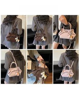 Detail shots of fashionable crossbody handbag in brown and pink with horse charm