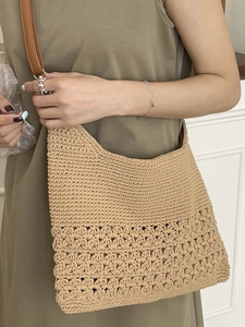 Casual beige woven straw shoulder bag for beach vacations with stylish leather straps