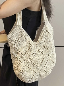 Bohemian cream crochet tote bag with geometric hollow weave pattern shown on model