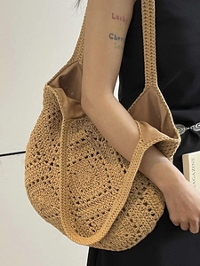 Handmade khaki crochet shoulder bag with hollow weave and fabric lining for beach vacation