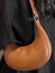 Brown faux leather crescent hobo bag for women with minimalist shoulder strap style