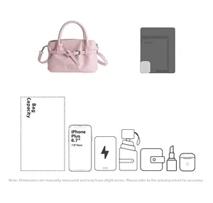 Pink bucket bag capacity showing space for 6.7 inch phone, umbrella and cosmetics