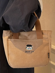 Sac à main en toile kaki épaisse avec broderie de fille et poignées robustes
