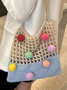 Women knit tote bag with colorful pom poms and mesh shoulder strap for casual spring style