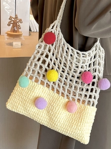Handcrafted knit tote bag with colorful pom-poms and contrast stitching for women