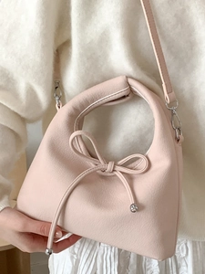 Pink faux leather shoulder bag with chic bow knot and silver metal ball accents