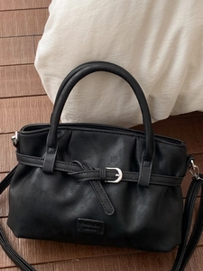 Classic black leather bucket bag with silver buckle and detachable shoulder strap