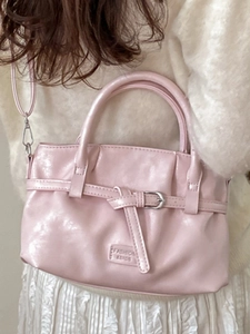 Pink faux leather bucket bag with top handle and silver buckle for women's daily commute