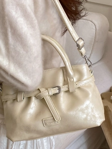 Chic cream white PU leather bucket bag with decorative belt buckle and shoulder strap