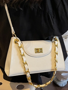 Chic white pleated crossbody bag with gold chain strap and turn-lock closure