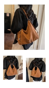 Detail of a brown suede tote bag showing its conversion from shoulder bag to backpack style