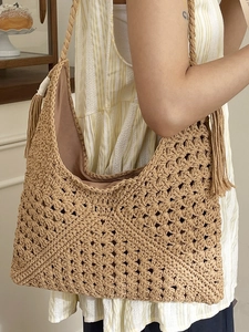 Large capacity woven straw tote bag with tassels and hobo shape for summer beach vacation