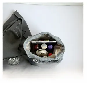 Top-down macro view of large tote bag interior showing spacious storage and magnetic snap