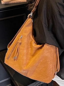Retro brown leather backpack for women, multi-functional shoulder bag with tassel detail