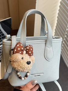 Light blue faux leather handbag with cute teddy bear charm and brand logo detail