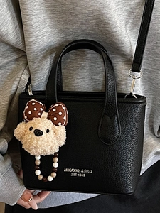 Chic black litchi pattern leather mini bucket bag with teddy bear charm for women