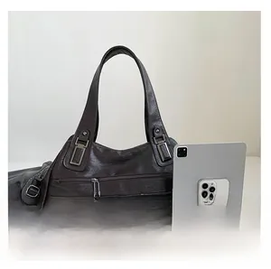 Size comparison of a retro dark brown tote bag next to a tablet and smartphone