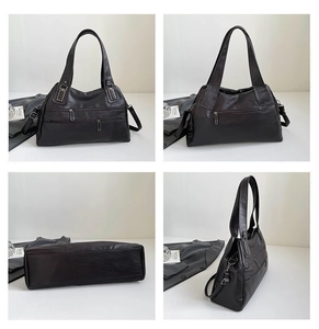 Macro view of vintage dark brown faux leather bag with silver zippers and dual handles