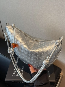 Silver woven metallic hobo bag with knotted shoulder strap and amber bead detail