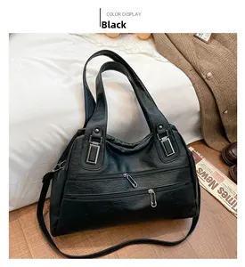 Close-up of black retro large capacity tote bag with multiple zippers and vintage texture