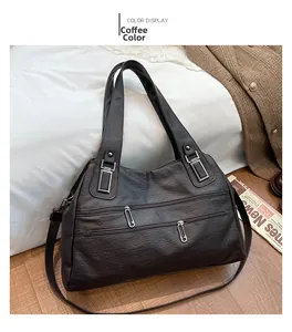 Detail view of coffee brown tote bag with leather texture and multi-pocket design