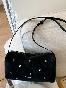Chic black crossbody bag with silver star rivets and adjustable strap for women