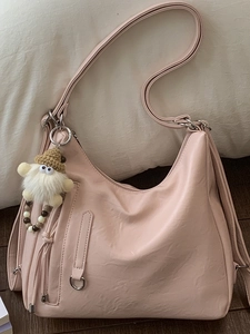 Pink minimalist faux leather hobo shoulder bag with a cute plush doll charm