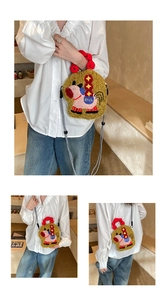 Close-up of olive green plush crossbody bag featuring cute pony embroidery and red handle
